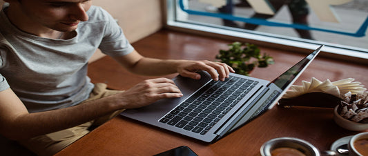two people working at a desk being entrepreneurial